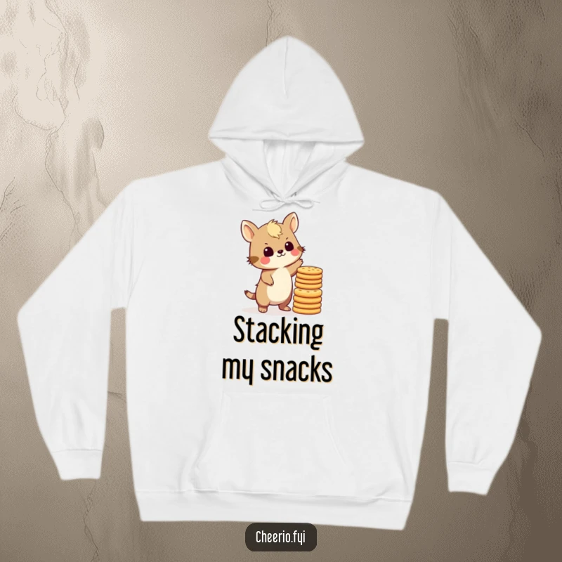 Funny British animal character struggling to balance a tall stack of biscuits, looking slightly stressed but endearing, on a cozy hoodie.