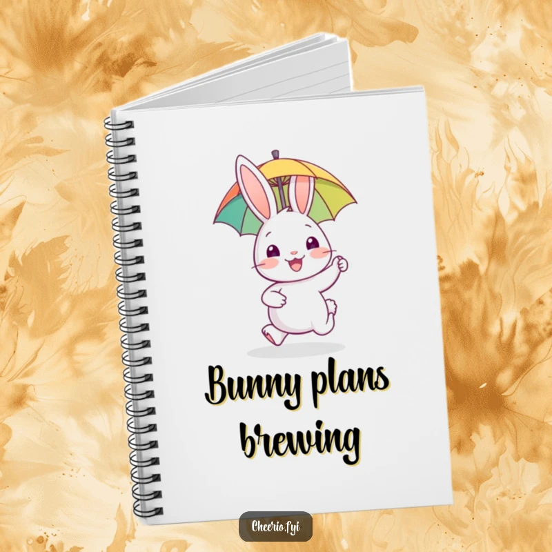 Funny notebook cover featuring a happy rabbit character gleefully hopping with a miniature umbrella, designed for creative writing.