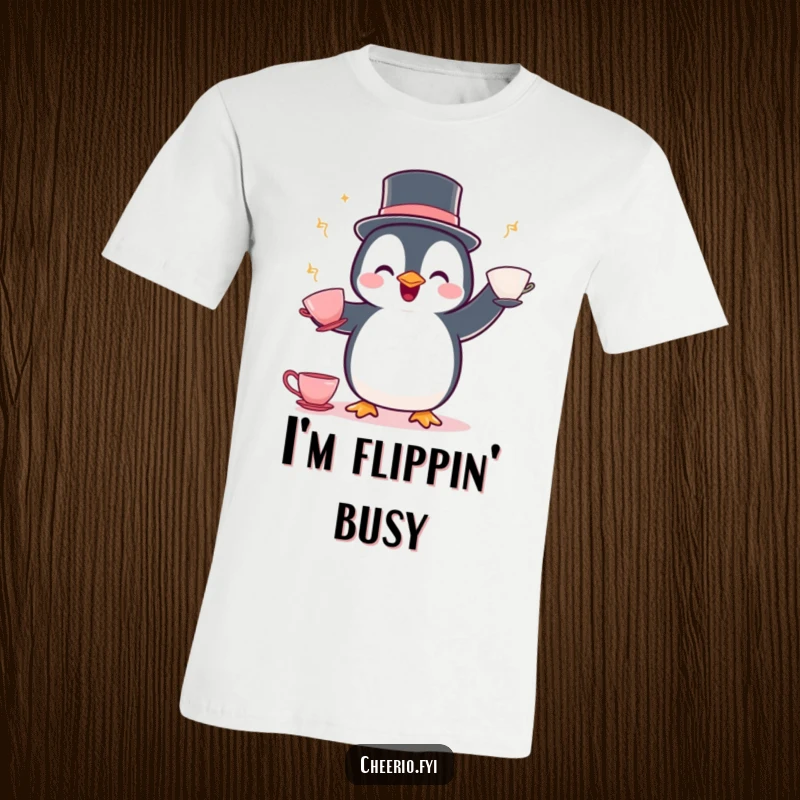 Funny Penguin Juggling T-Shirt: A delighted penguin wearing a bowler hat showcases its juggling skills with teacups.